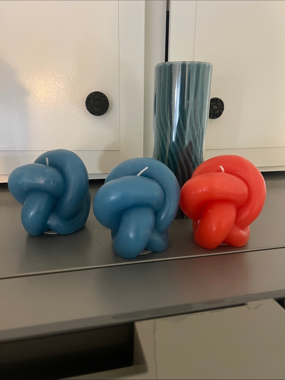Knot-Shaped Decorative Candles in Blue and Coral